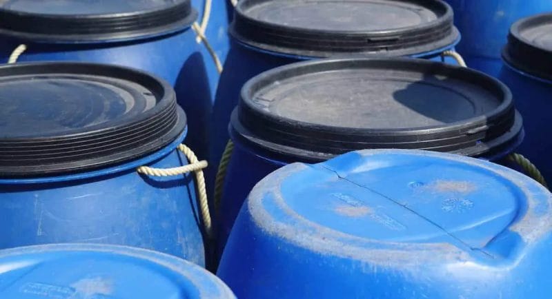 water storage containers blue plastic barrels