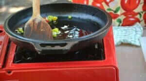 frying garlic and chilis in cast iron skillet