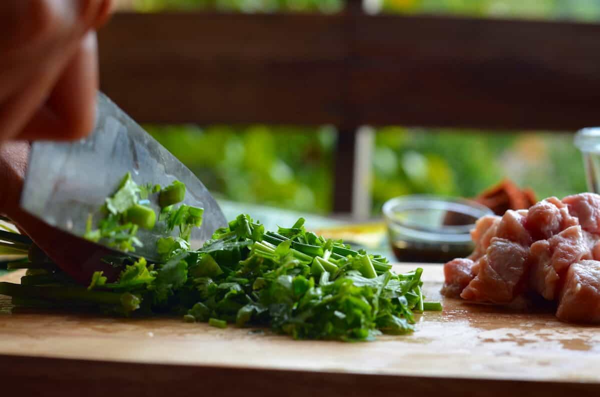 cutting thai parsley for kao soi