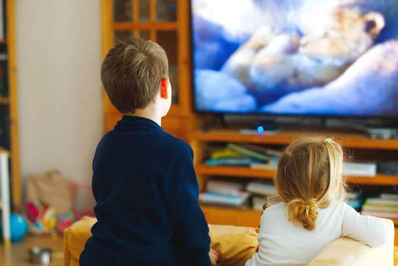 children enjoying an educational show for toddler on a big screen tv