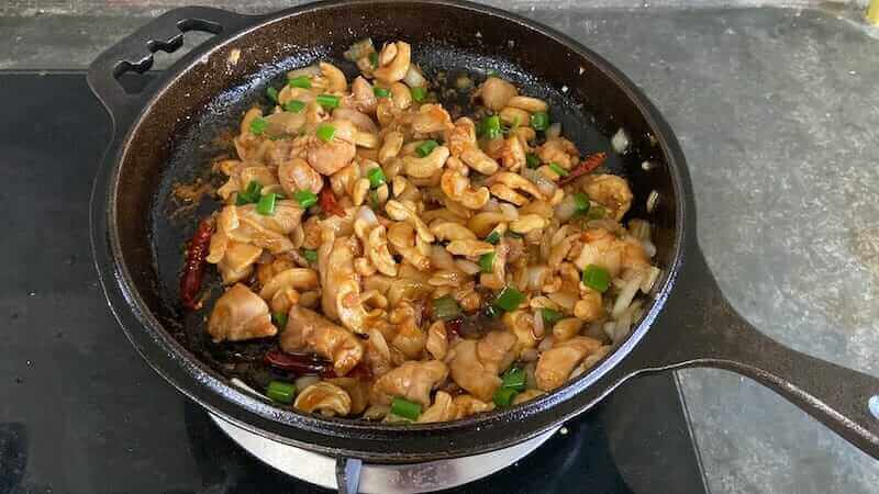 thai Cashew nut chicken stir fry in iron skillet