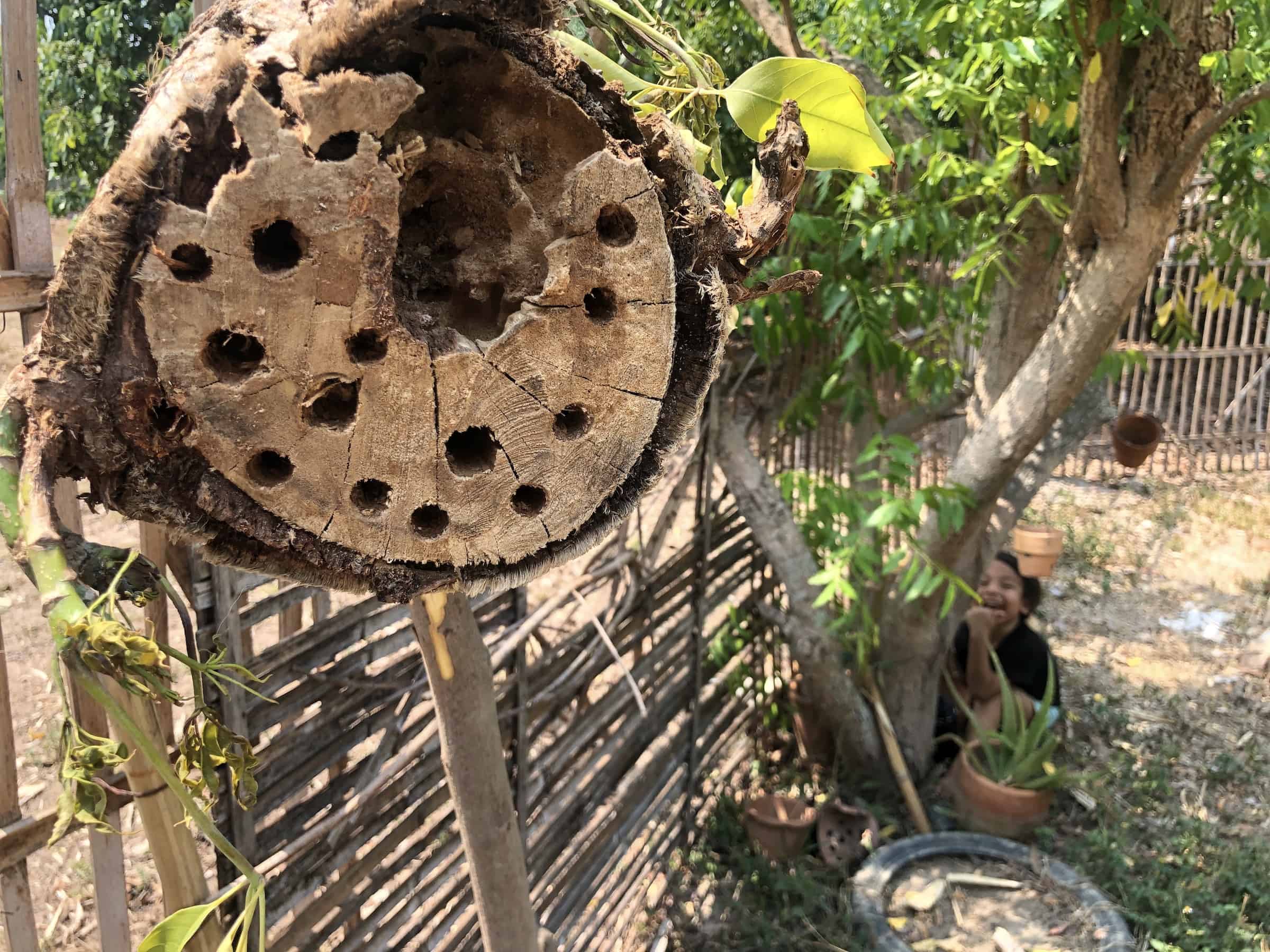 how to make a bee hotel from a log like this one on a post